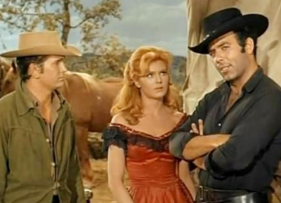 A shot from Bonanza featuring Michael Landon, Patricia Blair, and Pernell Roberts