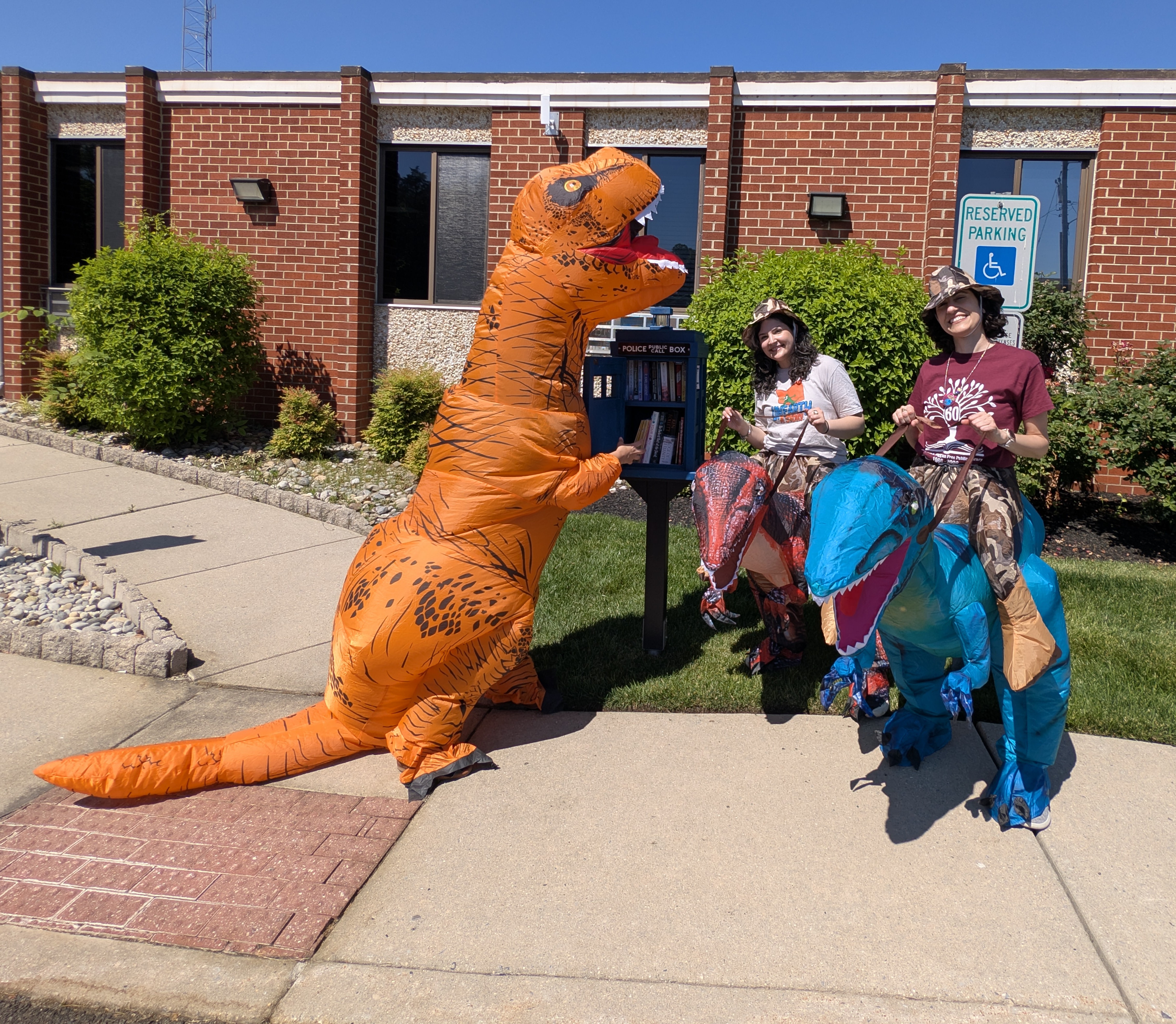 Rebeccasaurus, Stephasaurus, and Sarasaurus in front of The Washington Township Police Department
