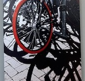 A bicycle tire with a bright red wheel.