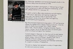 A photograph of photographer Ron Farina, smiling while wearing a black cowboy hat and black jacket. The photograph is accompanied by a passage about the artist. 