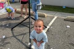 A young child in an aqua blue shirt
