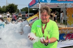 Library Director Sheila Mikkelson holds foam